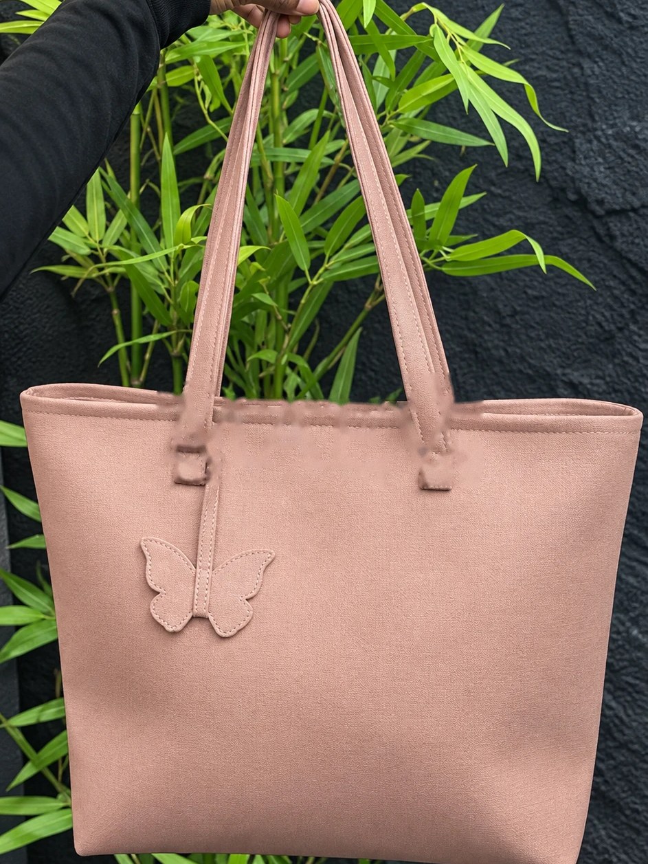 MAEV tote in Mauve, a dusty rose with a butterfly charm