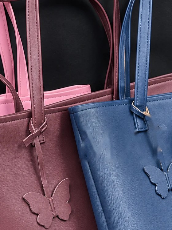 MAEV tote in Wine, a rich burgundy with a butterfly charm